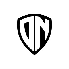 DN monogram logo with bold letters shield shape with black and white color design