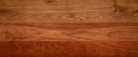 Empty solid wood desktop texture background. North American cherry wood planks natural texture...