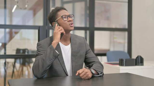Angry African American Man Talking on Phone