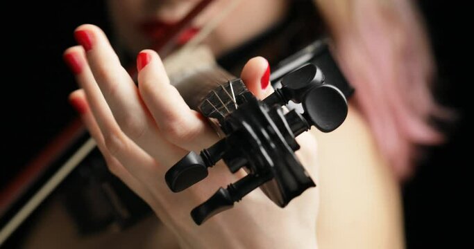 black electric violin plaid by an electric woman