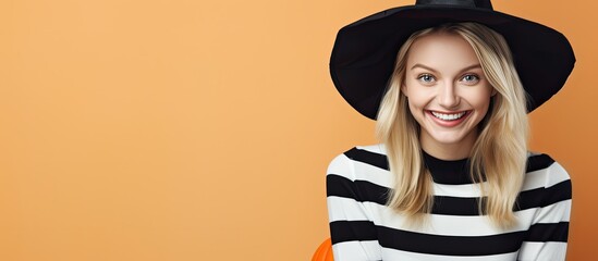 A stylish lady wearing a striped black and white top and a matching black hat