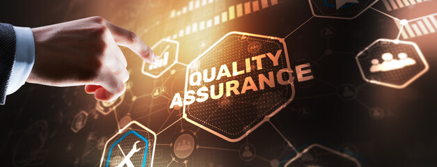 QA Businessman pressing Quality assurance button on virtual screens