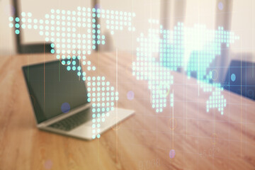 Multi exposure of abstract creative digital world map on modern laptop background, tourism and traveling concept