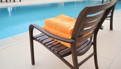 Pool towel on chair decoration around swimming pool in hotel resort - Powered by Adobe