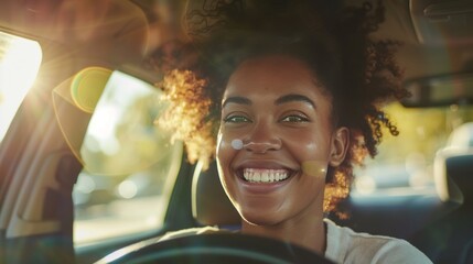 A woman with curly hair is smiling and driving a car - 766199468