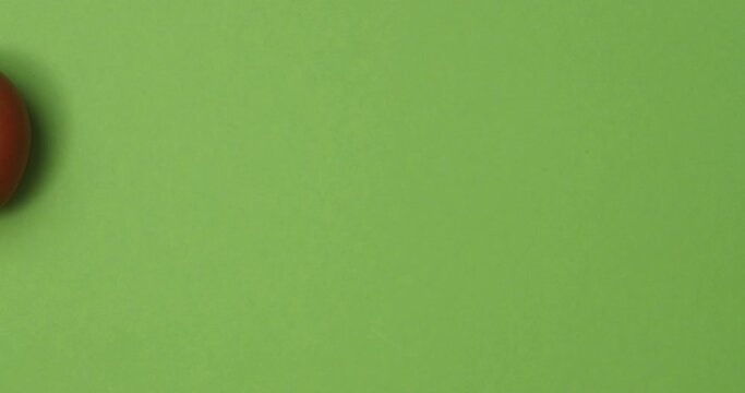 Easter egg transition on green paper backgrounds. 4K Stop motion animation.
