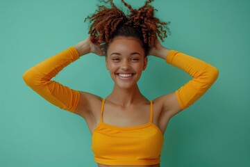 Happy Young Woman in Orange Sportswear Feeling Refreshed