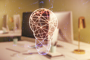 Creative light bulb hologram on modern laptop background, idea concept. Multiexposure