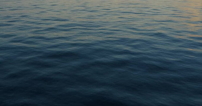 blue sea surface at sunrise