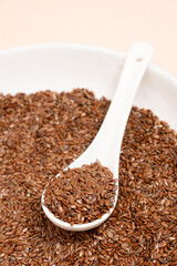 Flax seeds in a plate close-up