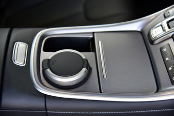 An ashtray on the console of a modern car - 766210024