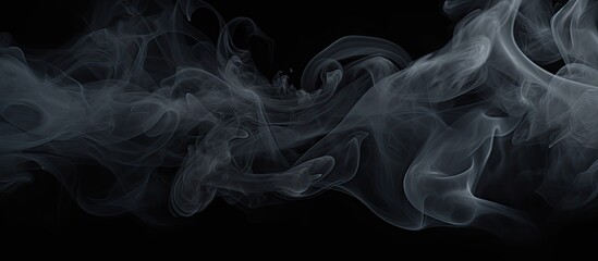 Smoke is billowing and swirling in the air against a black background, creating a mysterious and atmospheric effect