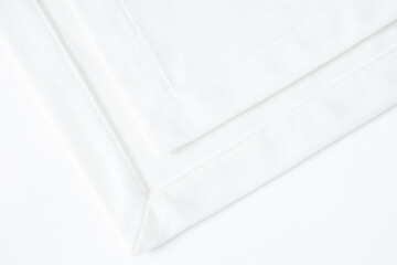 a white cloth with a corner