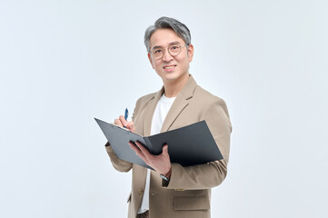 A middle-aged man in a suit and glasses is holding a document file and posing with a variety of confident expressions.