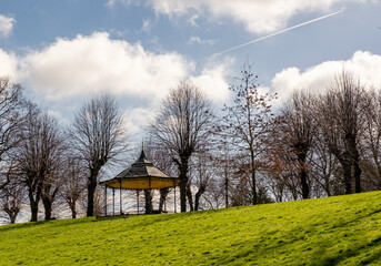 Wooden bandstand or pavilion in a public park - obrazy, fototapety, plakaty
