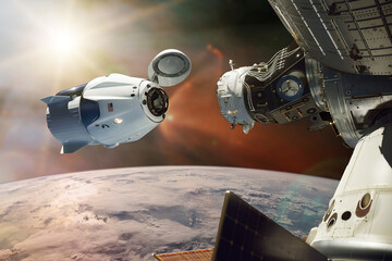 Cargo spacecraft in low-Earth orbit. Elements of this image furnished by NASA. © Paopano