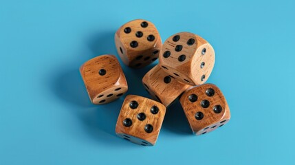There are wooden dice with text on them being rolled on a blue background, seen from above.