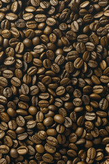 Background with close-up image capturing the rich, dark tones and intricate textures of roasted coffee beans. Ideal for projects related to coffee, beverages, or gourmet food - 766233883