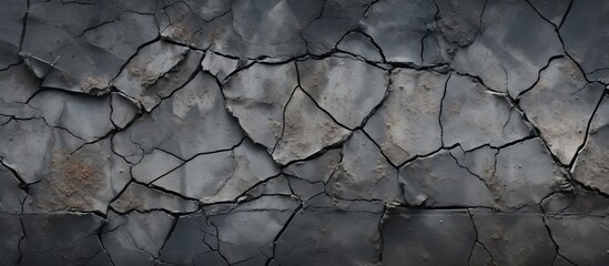 A Twig stuck in the cracked stone wall, frozen water seeped in between. The sky above reflects off...