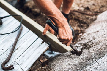 Spring time DIY handyman terrace construction.