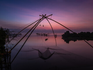 Beautiful landscape morning sky sunrise, Fishing using giant nets Thale Noi Wetlands at Baan Pak Pra is a famous landmark of Phatthalung, Thailand.