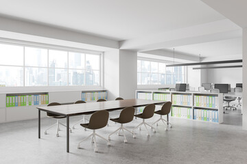 Stylish office interior with meeting table and coworking zone, panoramic window
