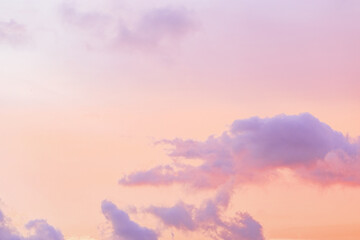 Pastel Sunset, violet fluffy clouds on pink peach colored sky, dreamy cloudscape pastel tones, surreal dreamscape at sunset, soft vivid colorful heaven as background, wallpaper, backdrop