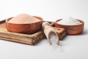 Fototapeta na wymiar Different types of natural salt on white background