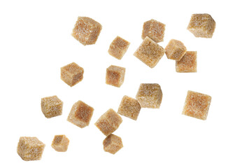 Brown cane sugar cubes falling on white background
