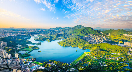 Aerial view of reservoir with mountain landscape and skyline in Shenzhen