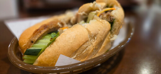 Sandwich Banh mi, vietnamese baguette with grilled chicken and mixed salad, vietnamese sandwich