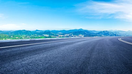 Foto op Canvas Empty asphalt road and modern city skyline with mountains in Shenzhen © zhao dongfang