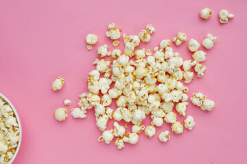 Sweet popcorn on pink background.