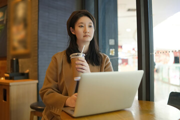 Contemplative Professional in a Casual Coffeehouse Setting