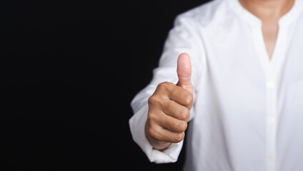 A thumbs-up indicates approval, agreement, or encouragement.