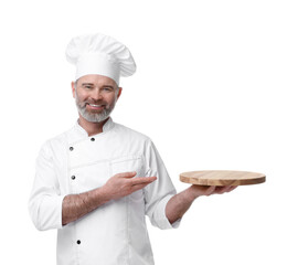 Happy chef in uniform pointing at wooden board on white background
