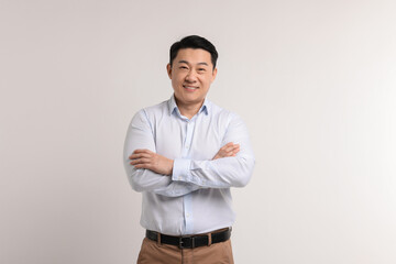 Fototapeta premium Portrait of happy man on light background