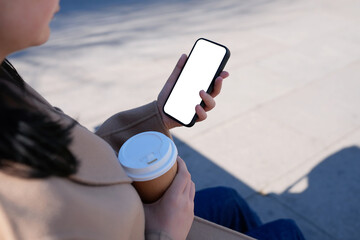 Modern Lifestyle: Young Woman Using Smartphone with Coffee