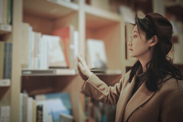 Young Woman Exploring Worlds Within the Bookshelves