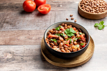  Vegetarian dish of stewed pink beans and tomatoes. A delicious bean dish served 
