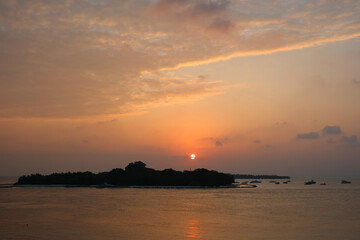 Beautiful sunset time art Rasdhoo Island. It's known for its solitude, calm atmosphere and perfect ecology. 