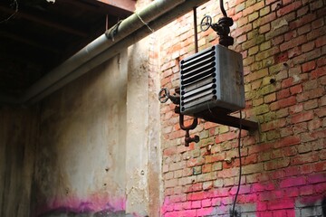 Rusty heating system in an abandoned factory building