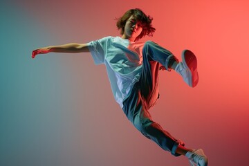 Vibrant Hip-Hop Dancer in Mid-Air Against a Gradient Backdrop Showcasing Style and Agility - obrazy, fototapety, plakaty