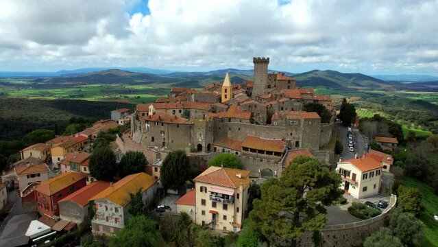 Italy travel and landmarks. Capalbio - charming small traditional top hill village (borgo) in Tuscany. Grosetto province. considered one of the most beautiful villages of Italy. aerial drone HD video