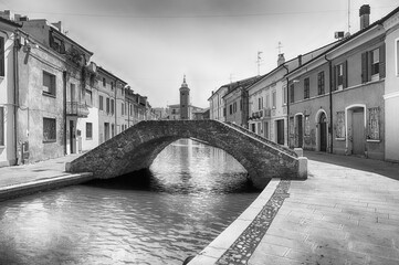 Walking among the picturesque canals of Comacchio, Italy