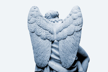 Angel with big wings close-up. God's messenger warrior is tired after fighting evil
