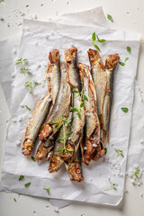 Fresh and salty smoked sprats as healthy snack. - 766306257