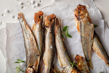 Fresh and salty smoked sprats with salt and herbs. - 766307430