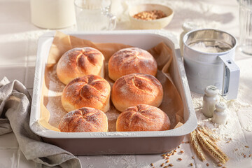 Tasty and homemade kaiser buns freshly baked in home bakery. - 766308402