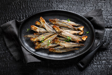 Tasty and salty smoked sprats marinated with salt and spices. - 766309487